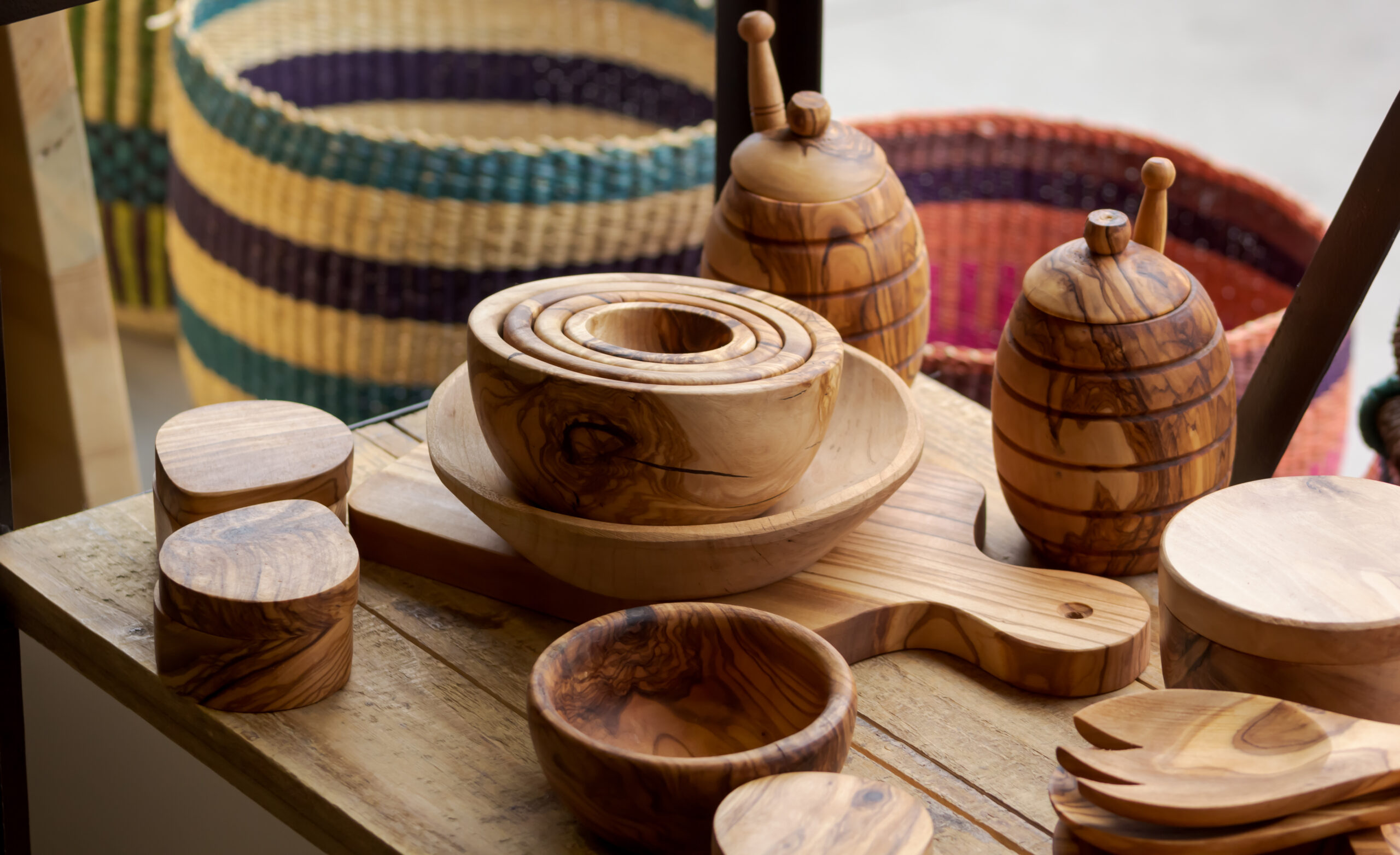 handmade wood bowls utensils and woven baskets ASD Market Week