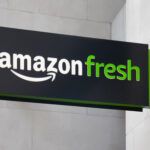 Amazon Fresh logo on shopping street sign.