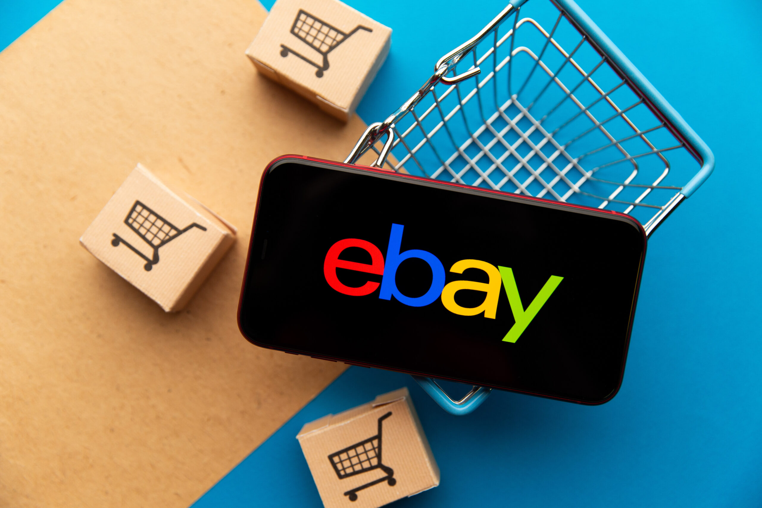 Ebay app logo on iPhone display.