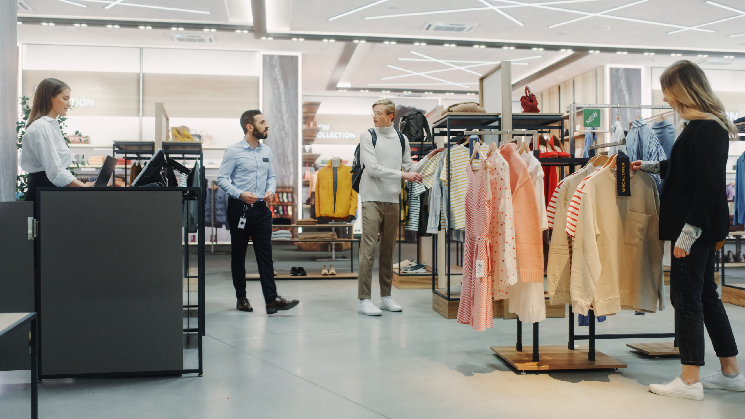 Customers Shopping in Modern Clothing Store