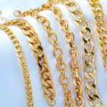 Gold jewelry on white background