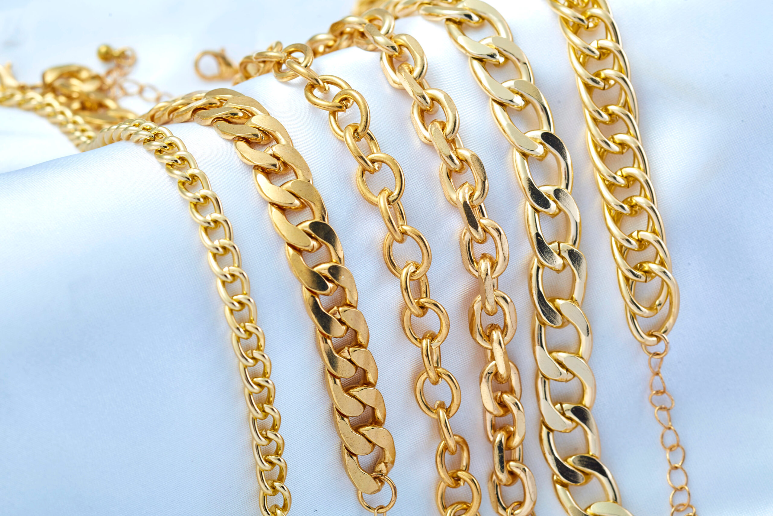 Gold jewelry on white background