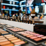 Showcase with powder and shadows in cosmetics store