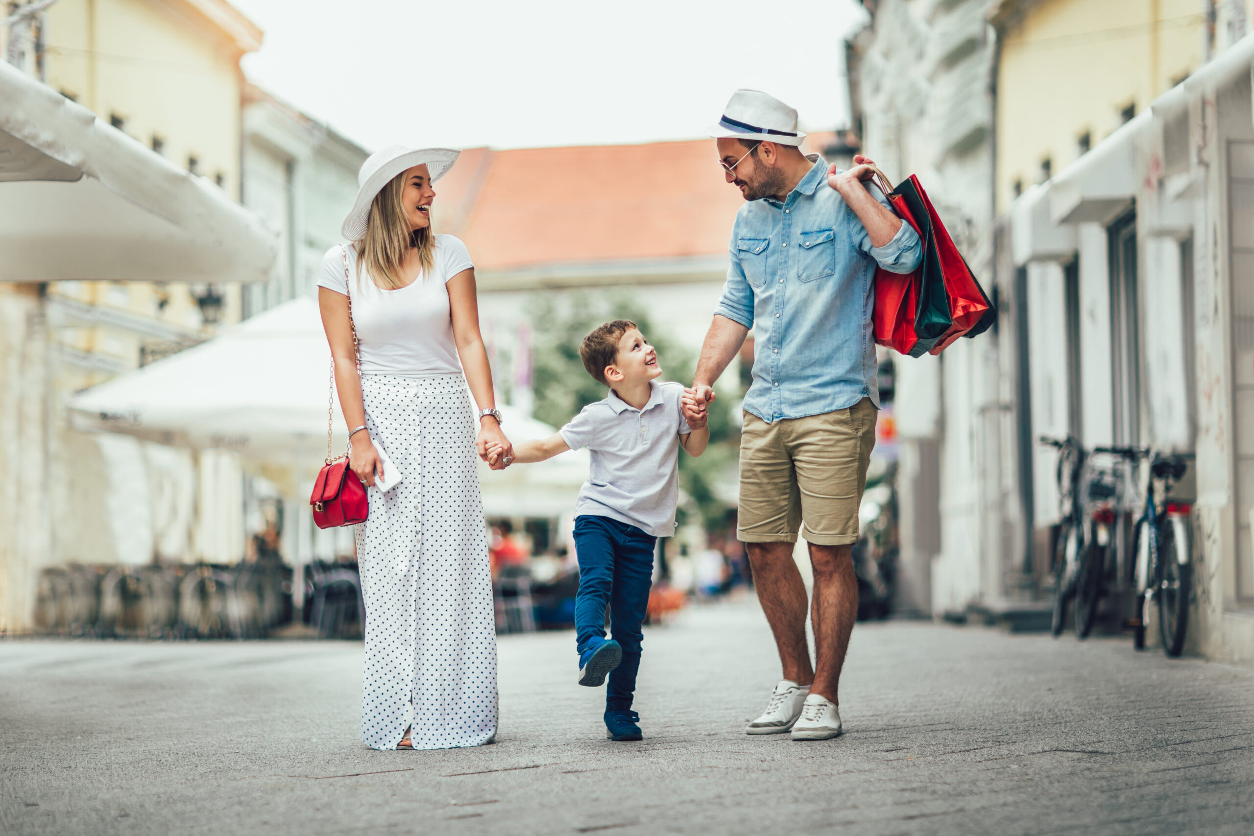 Happy family having fun outdoor after shopping