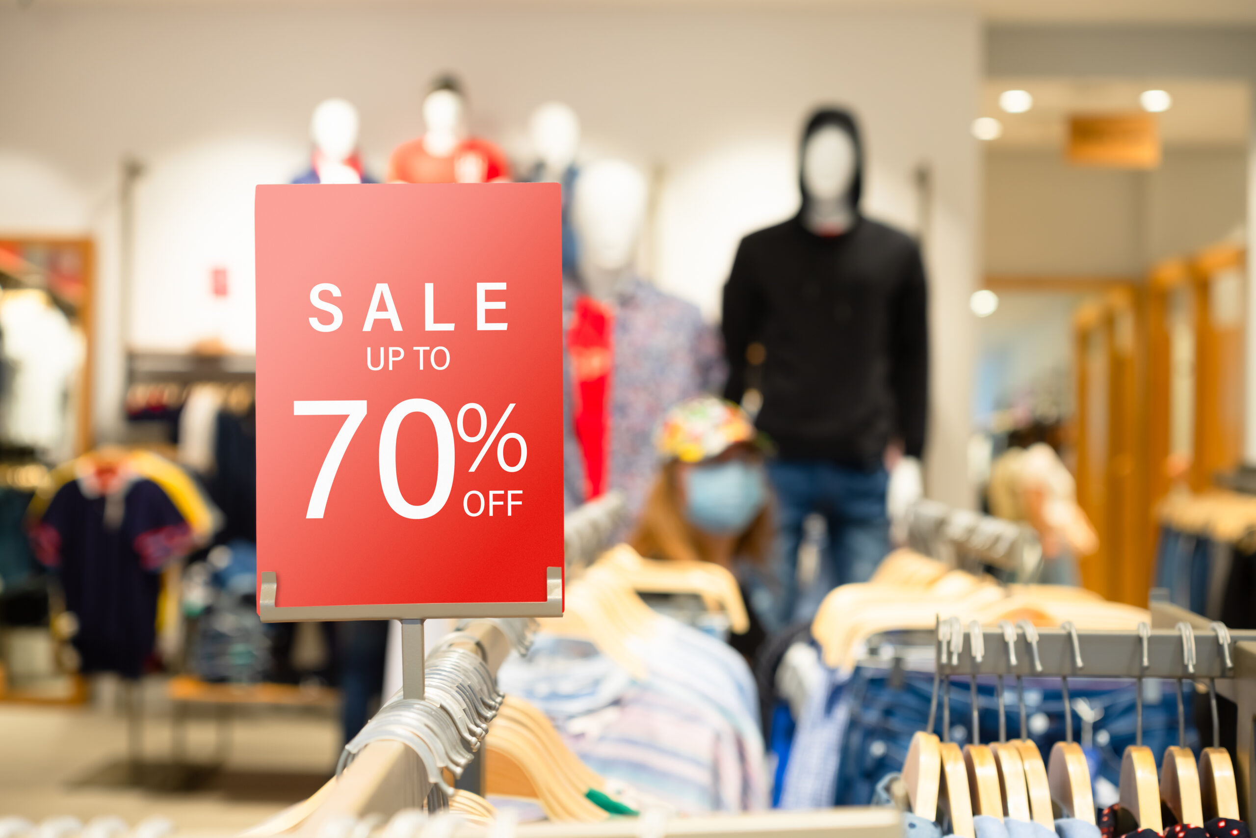 Sale label stand template on shelve in male clothing store for sale promotion and discount