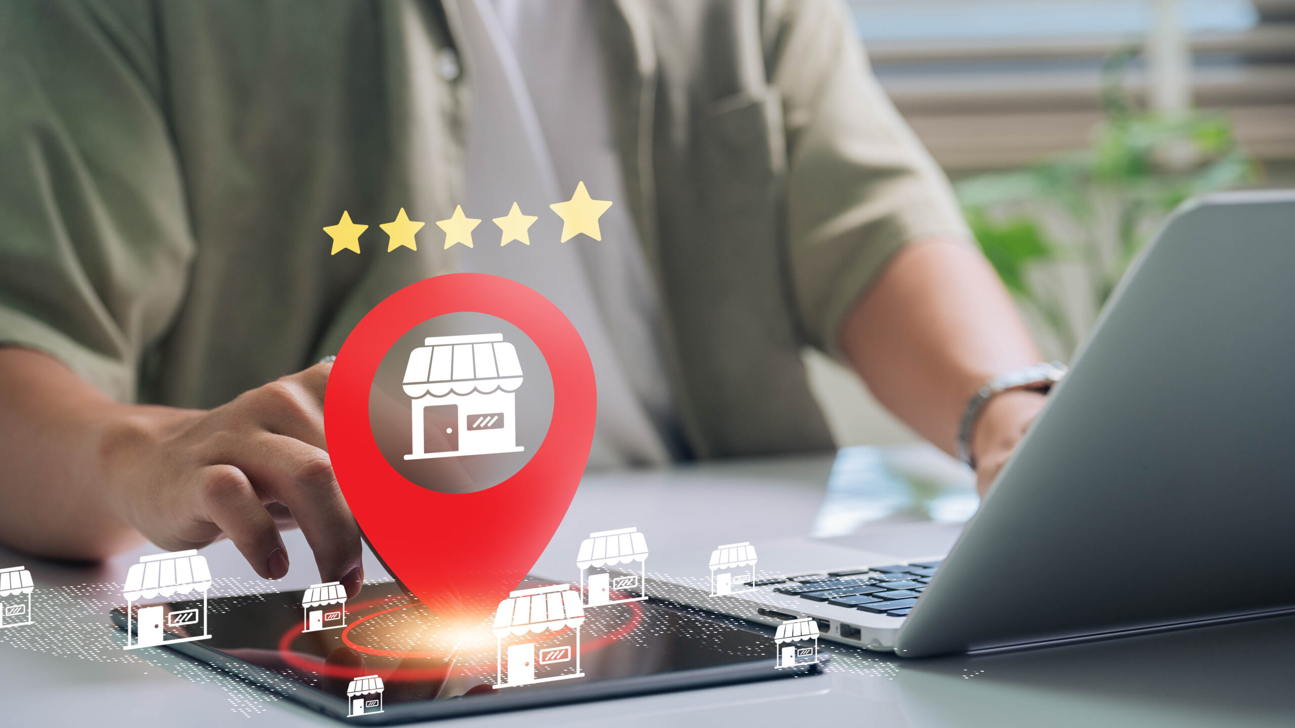 Man on computer and tablet with SEO pop ups and high store rating graphics