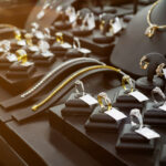 Gold jewelry diamond shop with rings and necklaces luxury retail store window display showcase