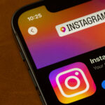 Instagram app is seen in the App Store on the screen of an iPhone.
