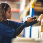 woman in inventory warehouse factory