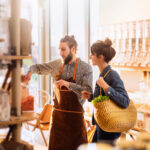 young woman shopping in a bulk food store.