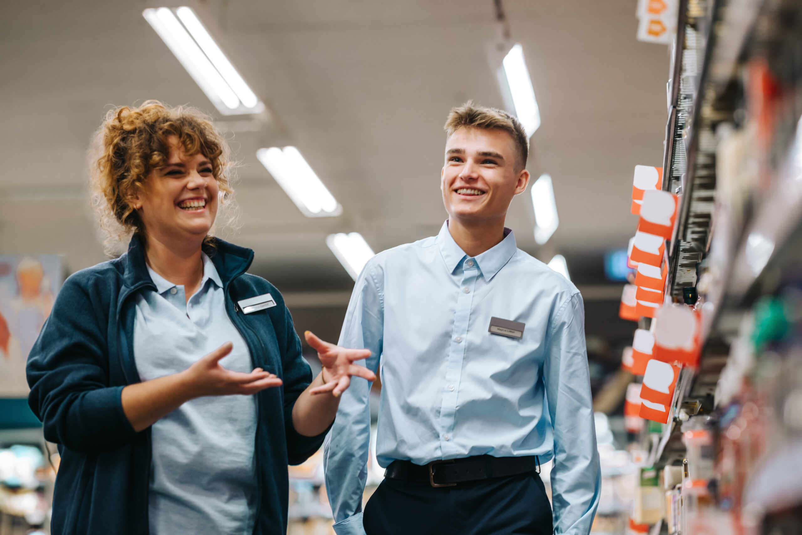 grocery store manager training new male employee.